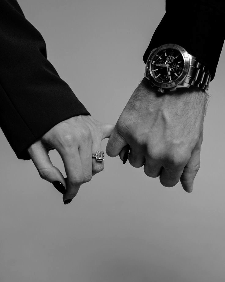 Vitali and Anna, hands linked, rings visible